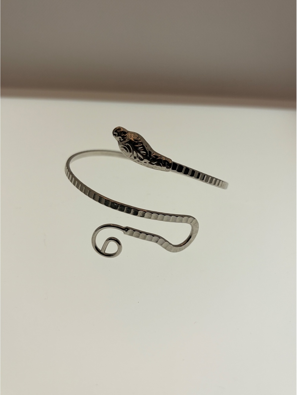 Silver tone bird wrap bracelet